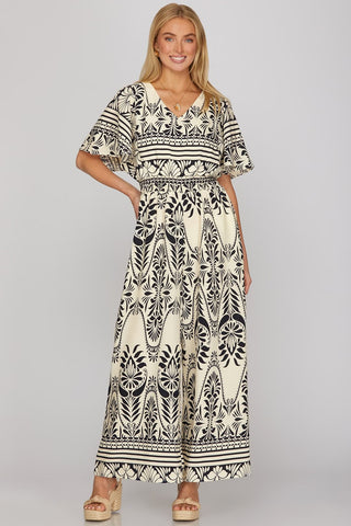 HALF SLEEVE WOVEN PRINT JUMPSUIT WITH ELASTIC WAISTBAND AND POCKETS