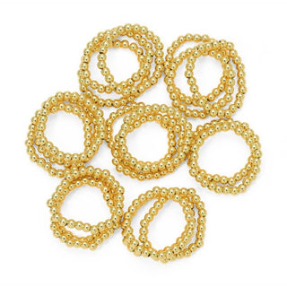 Gold beaded bracelets on a white background