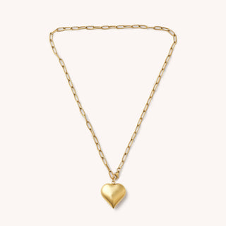 Gold heart-shaped pendant necklace on a white background