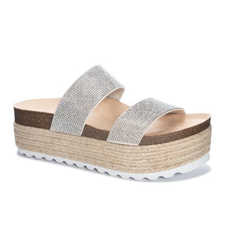 Silver embellished sandal with a woven platform on a white background