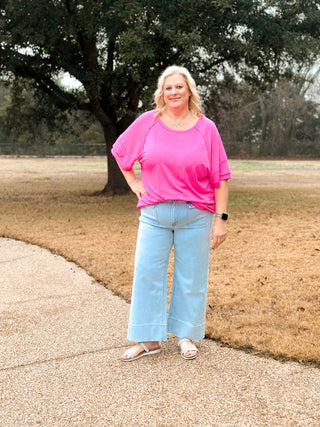 pink terry top with raw edges and relaxed fit