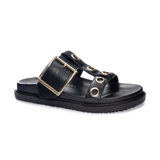 Black sandal with gold buckles and eyelets on a white background