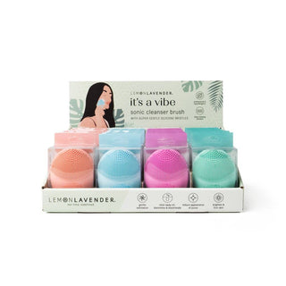  Sonic cleaner brush with four brushes in pink, blue, purple, and green.